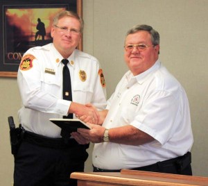 FFAM President Kenneth Hoover presents Fire Marshal Randy Cole with a certificate of appreciation 