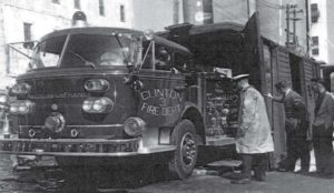 Clinton’s new fire truck is shown being unloaded from a Frisco freight car at the Larabee docks. It was shipped from the American LaFrance factory in Elmira, New York. The truck will be tested today. Watching the unloading is James Coleberd and Councilman James Thorton, Maurice Holmes and Harold Stewart.