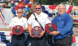 Cedar Hill Fire Protection District Fire Chief Terry Soer, Lieutenant Mick Fischer and the District Board President with their County Awards.